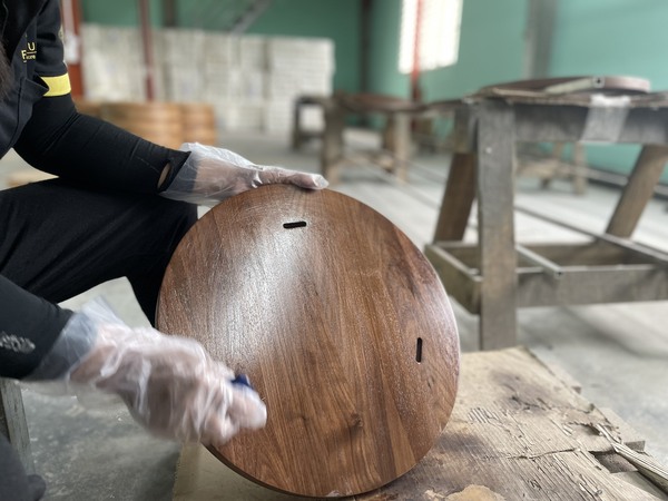 QA Furniture staff is processing the chair surface