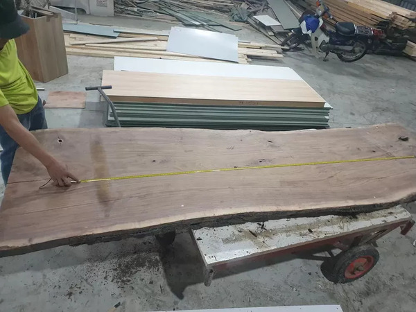 Factory producing walnut wood furniture for export in Vietnam