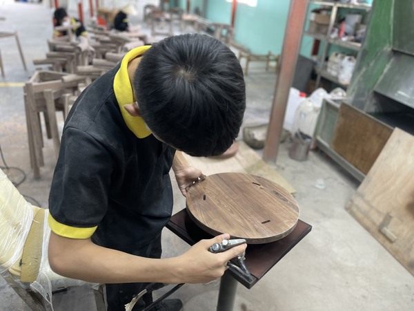 QA Furniture employees are currently assembling the products