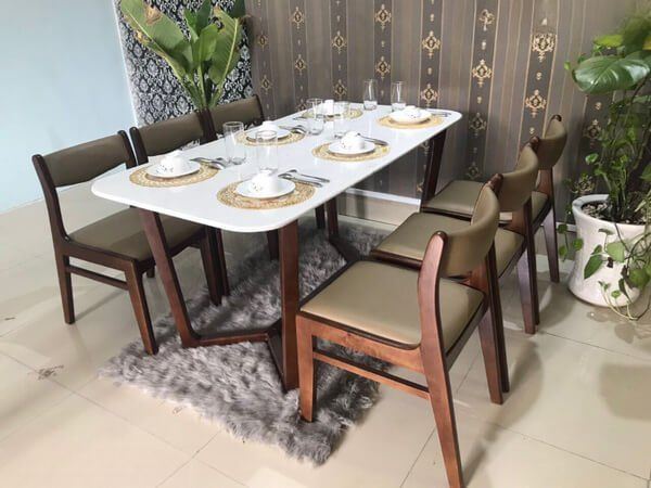 The high-end upholstered dining table and chairs model