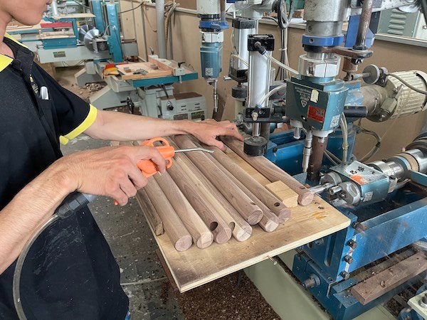 The team of workers carefully processed the wood before assembling