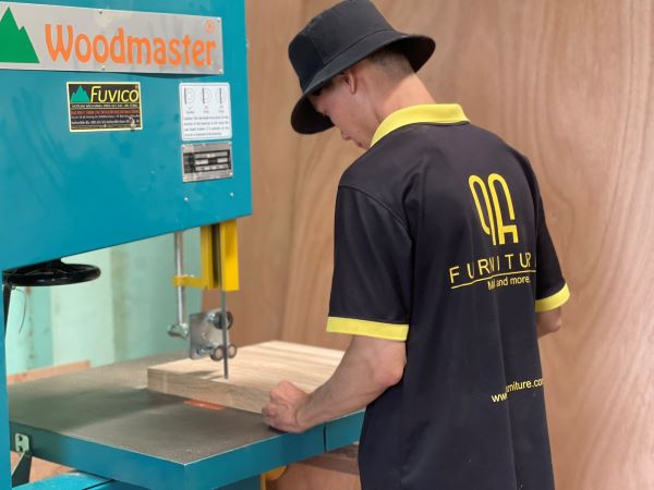 QA Furniture technical staff perform wood cutting and trimming