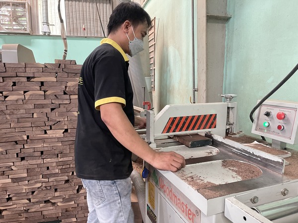 QA Furniture employees are working at the manufacturing factory