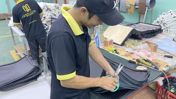 QA Furniture's employees are diligent and dedicated to their work at the factory.