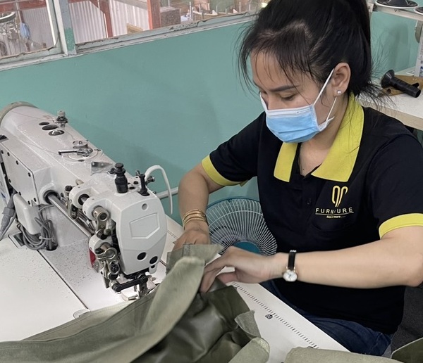 The QA Furniture staff is meticulous in every stitch