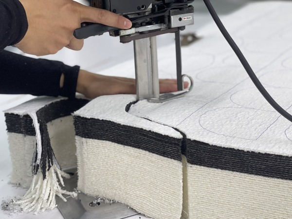 QA Furniture uses cutting machines to swiftly handle large volumes of fabric