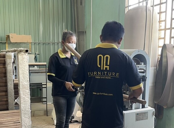 Staff at the QA Furniture factory